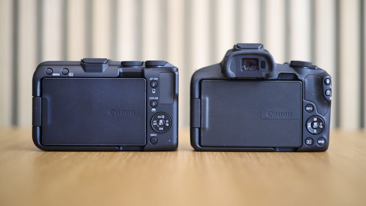 Canon EOS R50 V side by side with a Canon EOS R50 on a wooden surface
