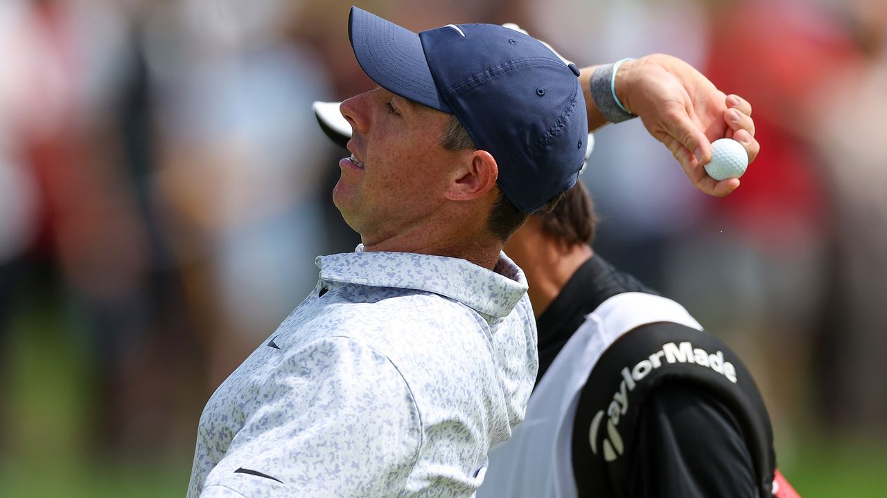 Rory McIlroy throws away his hole-in-one ball at the Travelers Championship