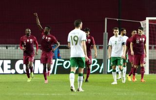 Mohammed Muntari, second left, celebrates after scoring Qatar’s equaliser