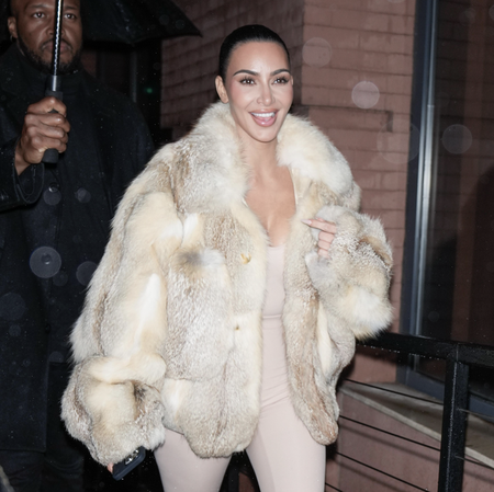 Kim Kardashian arrives at the 60th birthday of Chris Rock also attended by her ex Pete Davidson at the Crane Club in New York City. Kim wore a revealing all cream bodysuit with a fur coat and heels. Pete appeared to be in high spirits flashing a peace sign and a thumbs up as he made his way into the venue.