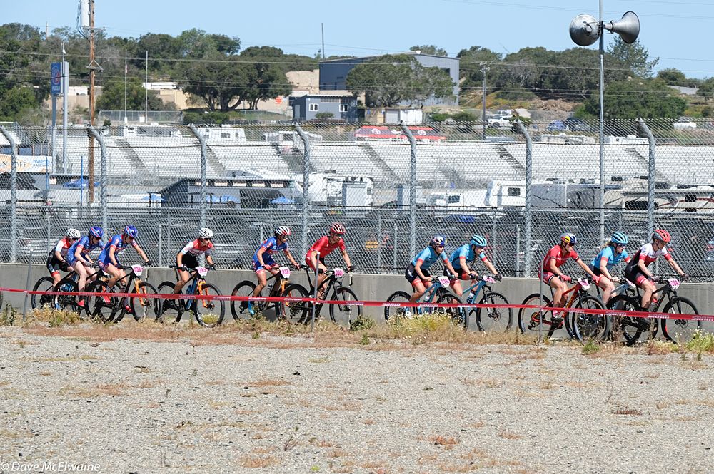The Pro Women ride along the outer edge of Laguna Seca Racetrack