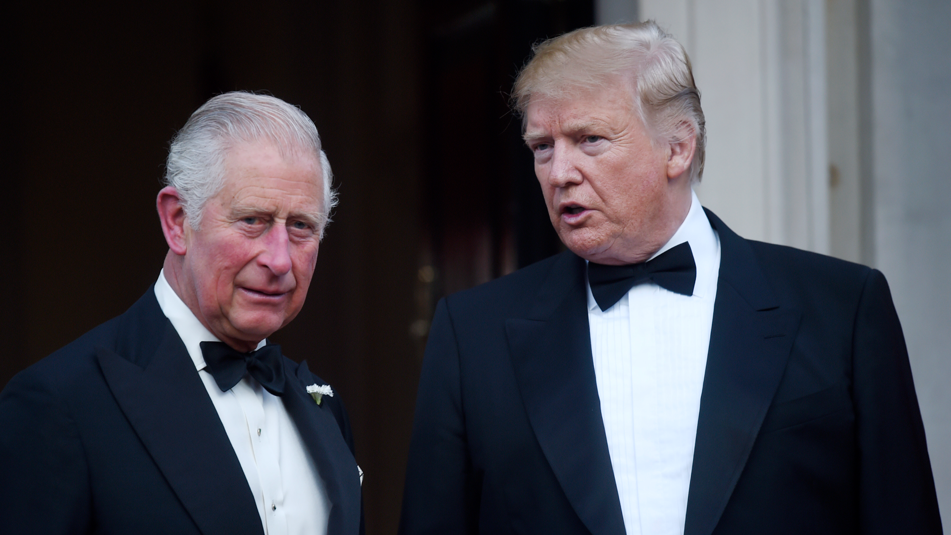 Donald Trump and King Charles wearing black tuxedos