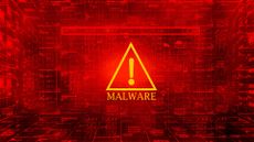 Malware concept image showing flashing alert symbol with flashing red background and network symbols.