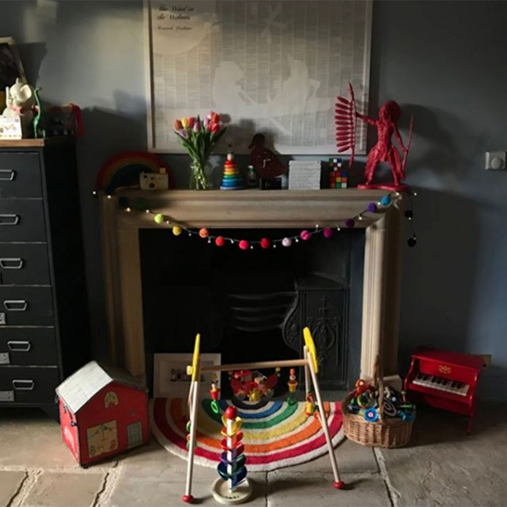 living area with fireplace and toys
