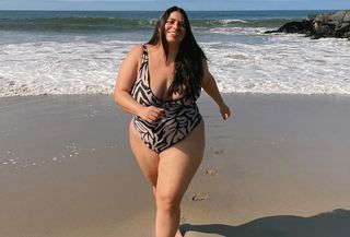Model running on beach wearing plus-size bikini
