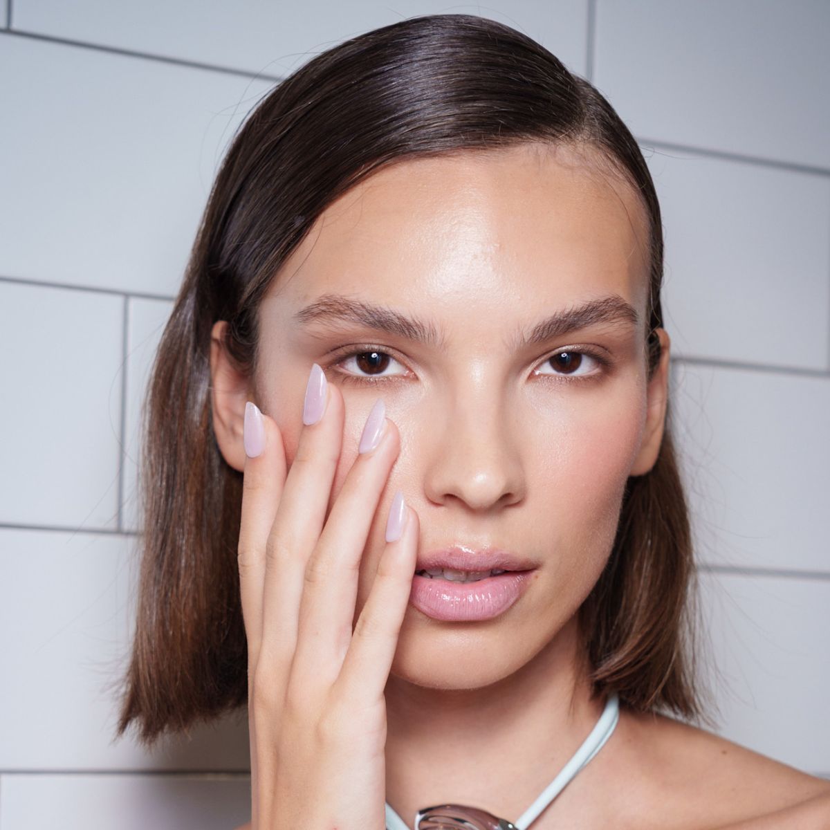 model backstage with long round nails