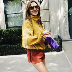 Reformation x Umbro campaign image of Devon Lee Carlson wearing the Valeria Anorak and Scottie Shorts