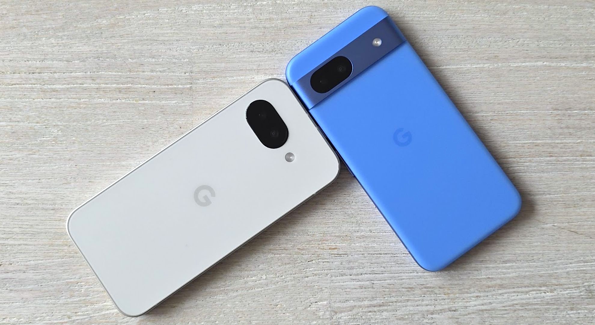 The Google Pixel 9a (left) beside the Google Pixel 8a (right)