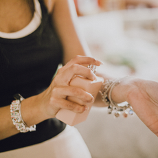 Fragrance created by AI: woman spraying perfume on her wrist