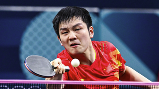 Zhendong FAN of China returns the ball ahead of the Sweden vs China men’s team table tennis final at Olympics 2024