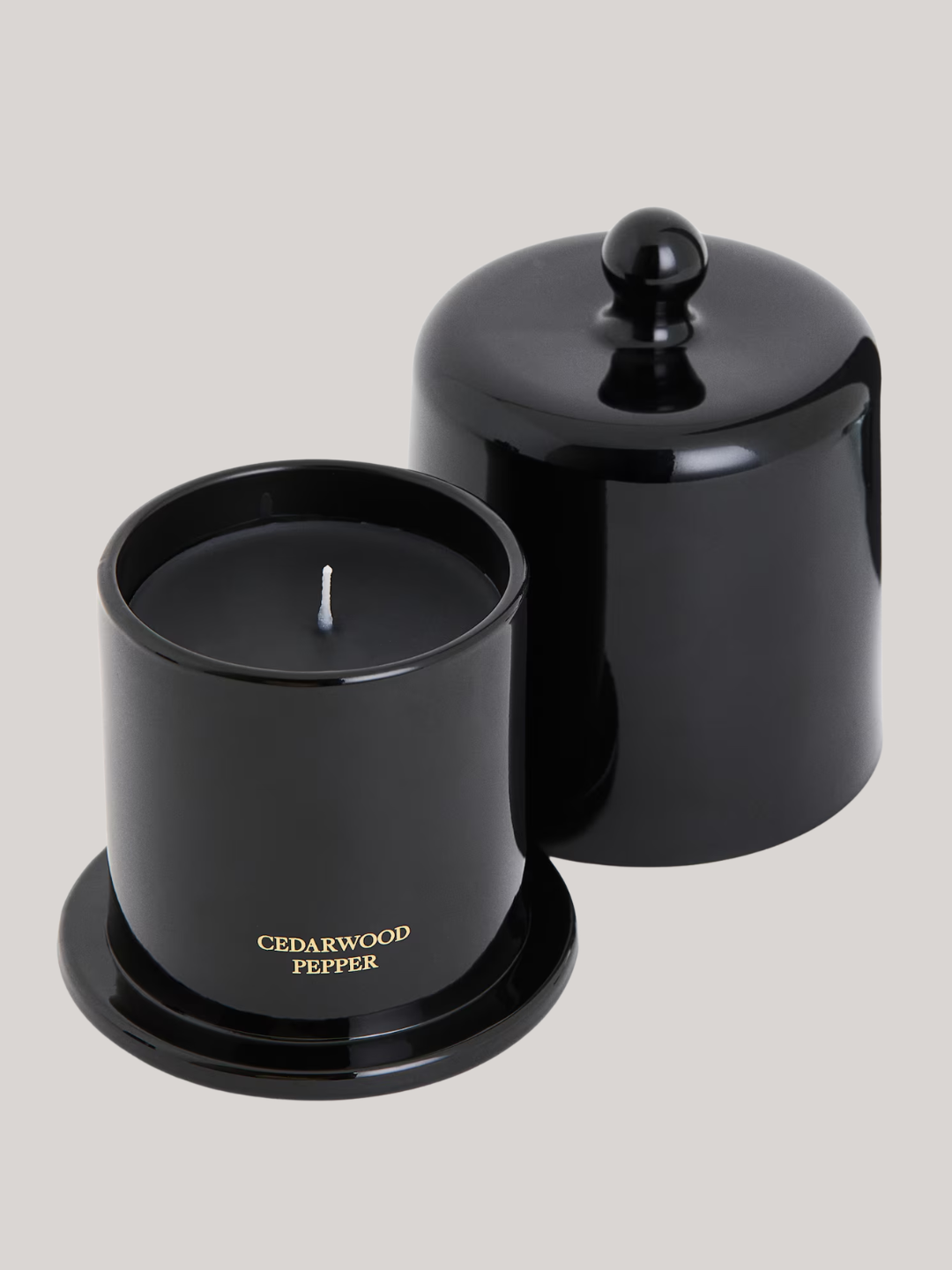 A black cloched lid candle with cedarwood and pepper scent from H&amp;amp;M