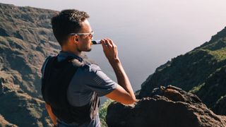 Runner eating energy gel