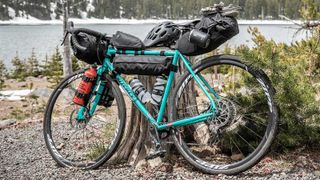 A Ritchey bike fully loaded with bags, bottles and more