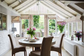 conservatory with white walls and hessian blinds