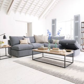 white living room with grey corner sofa with concealed storage in seat
