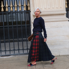 @greceghanem wears plaid maxi skirt navy jumper