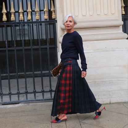 @greceghanem wears plaid maxi skirt navy jumper