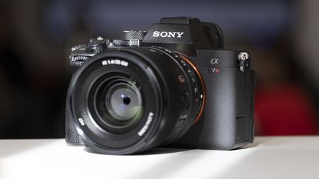 The Sony A7R V camera sitting on a white table