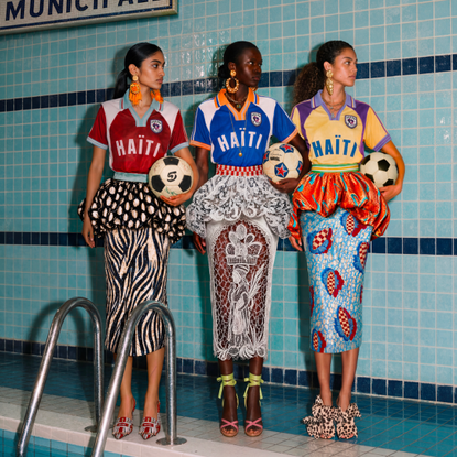 three women wear Stella Jean Haiti football shirts