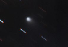The first color image of the comet C/2019 Q4 (Borisov), which astronomers believe to be the first known interstellar comet ever identified, was captured by the Gemini North telescope at Hawaii's Mauna Kea. Gemini North acquired four 60-second exposures in two color bands (red and green). The blue and red lines are background stars moving in the background.