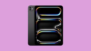 The iPad Pro on a pinkish background.