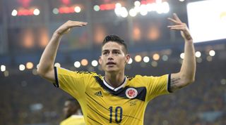 Colombia's midfielder James Rodriguez celebrates after scoring during the Round of 16 football match between Colombia and Uruguay at the Maracana Stadium in Rio de Janeiro during the 2014 FIFA World Cup on June 28, 2014. AFP PHOTO / DANIEL GARCIA (Photo credit should read DANIEL GARCIA/AFP via Getty Images)