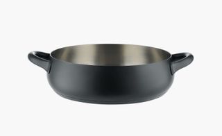 Alessi presented kitchenware with a sleek matt black finish. A pot with two handles and a matt black finish.