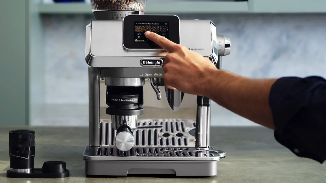 Person's hand using touchscreen on De'Longhi La Specialista Touch coffee machine