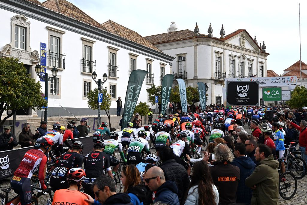 FARO PORTUGAL FEBRUARY 17 A general view of the peloton while fans cheer prior to the 49th Volta ao Algarve em Bicicleta 2023 Stage 3 a 2031km stage from Faro to Tavira VAlgarve2023 on February 17 2023 in Faro Portugal Photo by Tim de WaeleGetty Images
