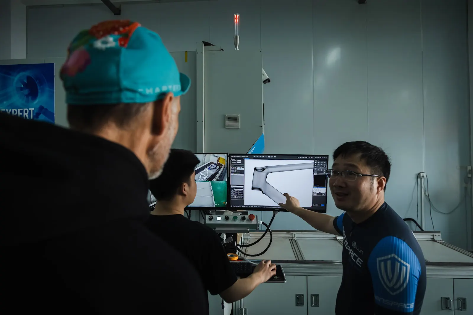 Engineers examine an X-ray of a carbon fibre frame