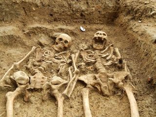 Skeletons holding hands