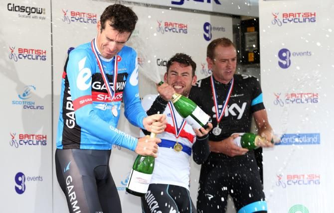 Cavendish starts the party going by spraying David Millar with champagne