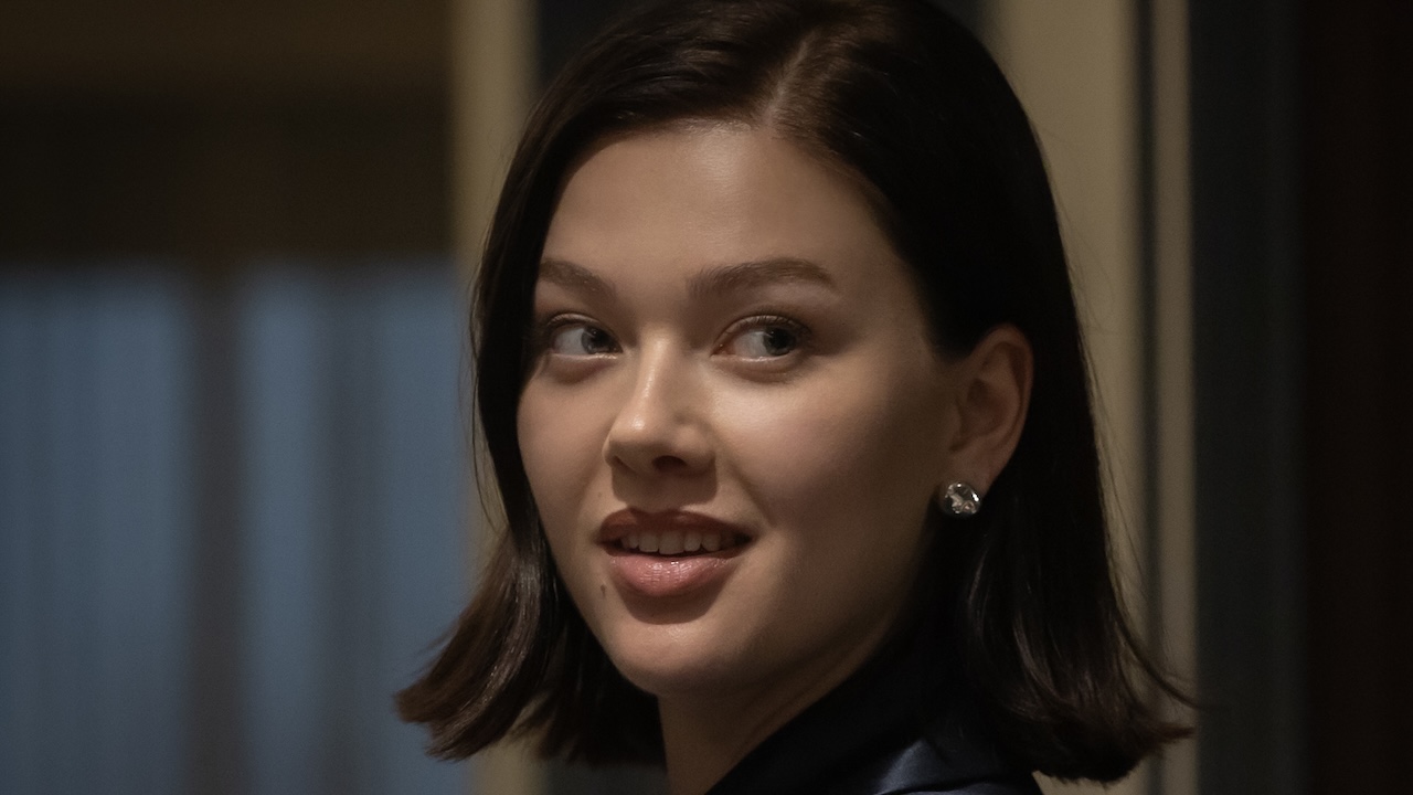 Jordan smiling at Cooper in hotel in The Beauty Season 1