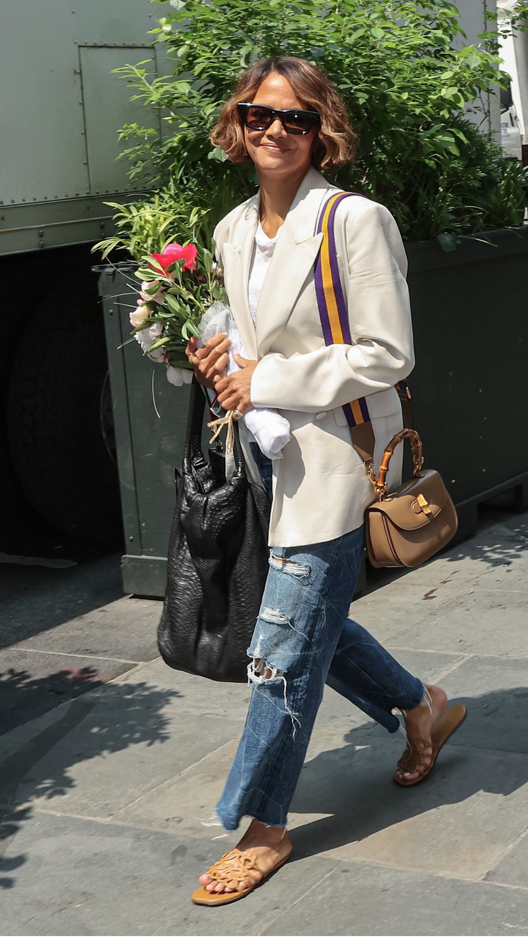 halle berry wearing a blazer and jeans outfit