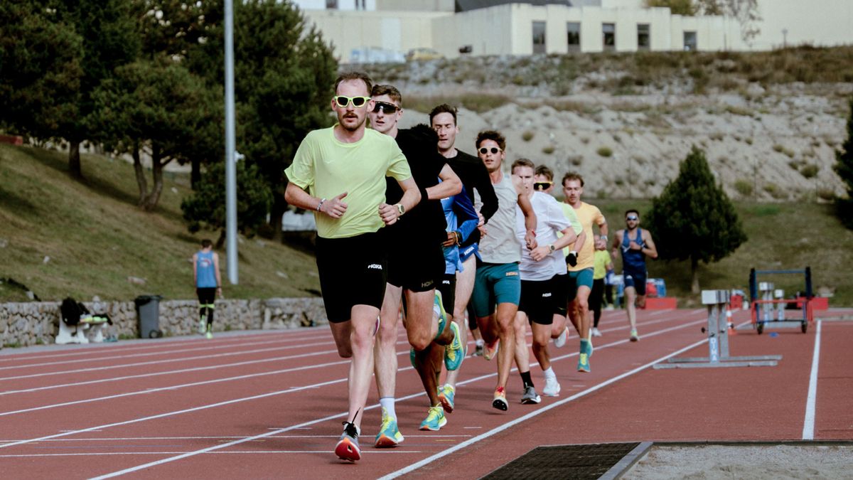 Group of runners training on a running track