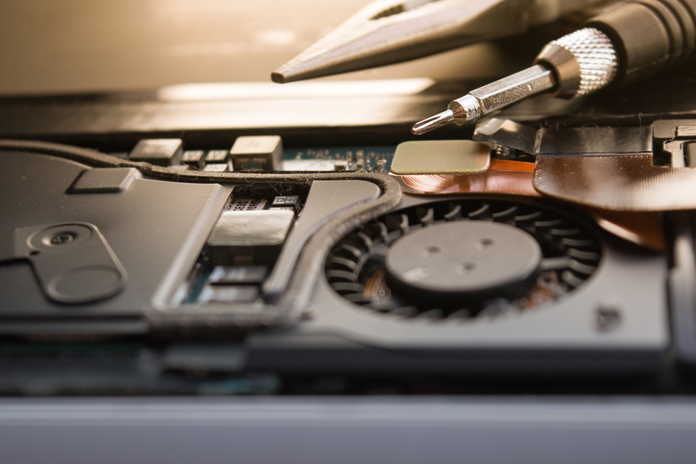 Stock image of a laptop being repaired