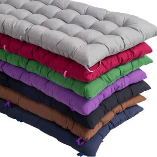 stack of colourful padded seat cushions