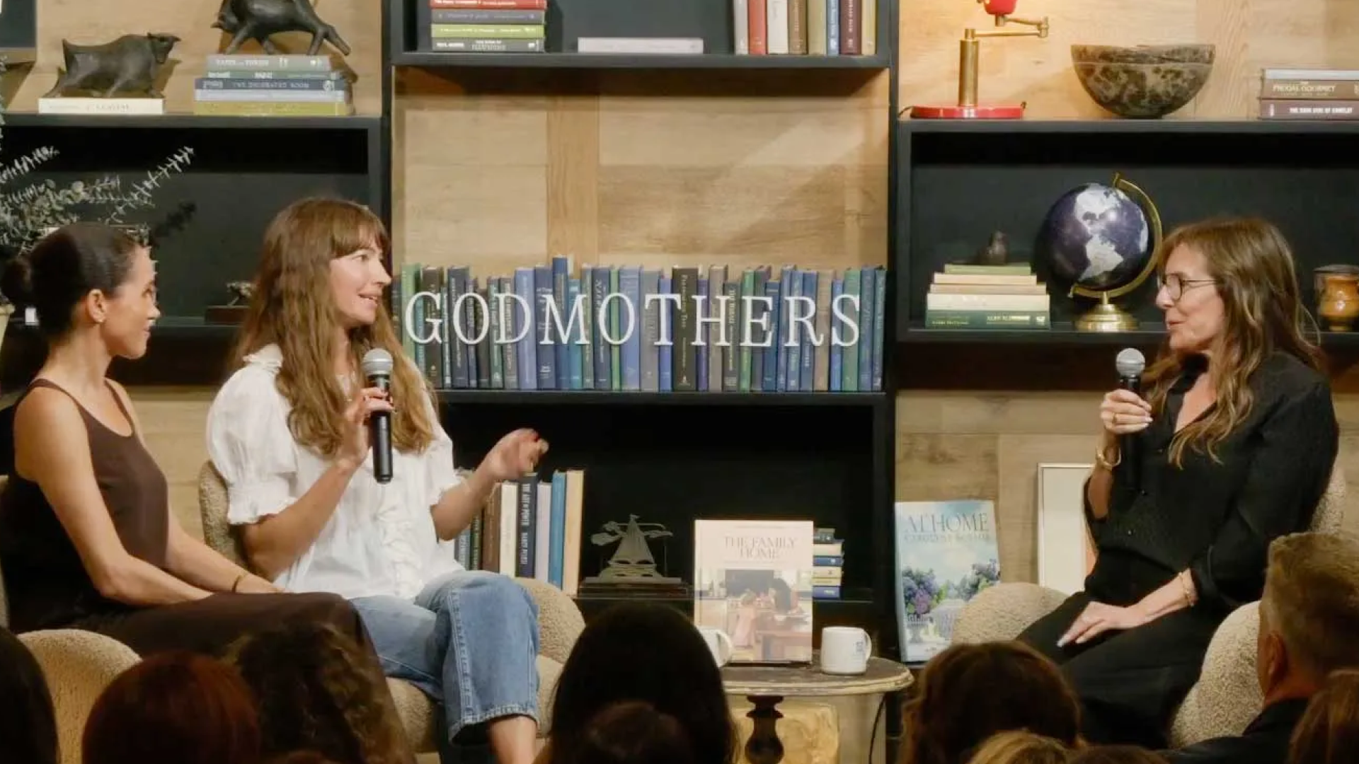 Meghan Markle sitting next to Courtney Adamo at Godmothers bookstore