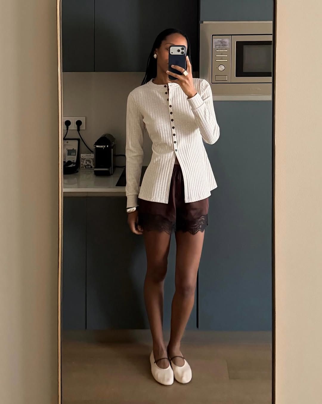 An image of a woman wearing white flats, shoe trend for spring 2026.
