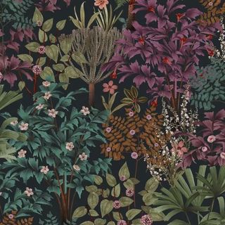 A close up of the Graham & Brown Jardin Botanico Wallpaper featuring green, purple and teal leaves