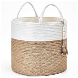 A white and beige decorative storage basket with handles and bead detail