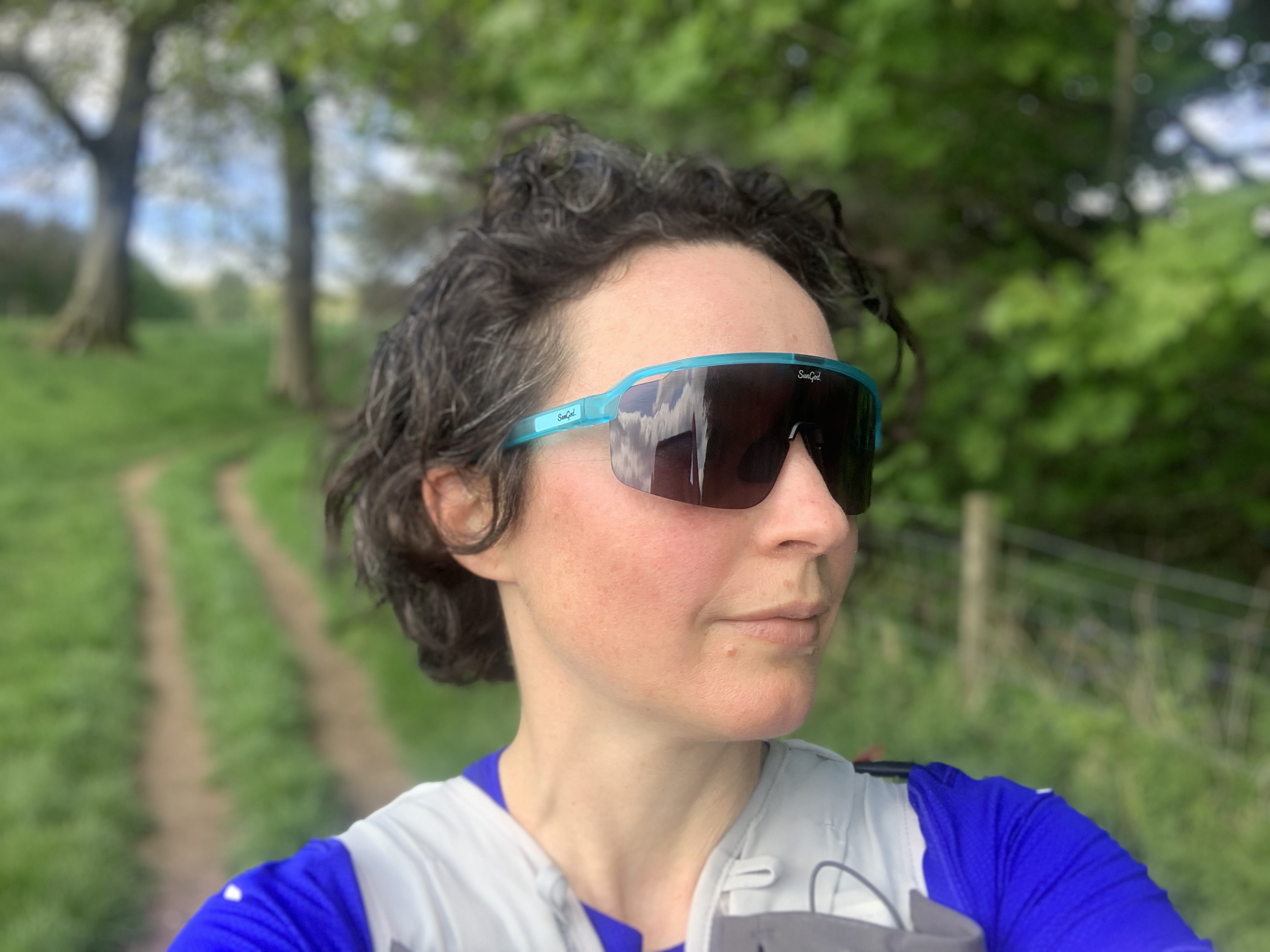 Julia Clarke on a trail run wearing the SunGod FORTY2s sunglasses
