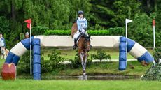 British rider Ros Canter and Izilot DHI jumping clear in the Luhm&uuml;hlen Horse Trials CCI5* cross-country to hold their lead.