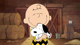 Charlie Brown hugs Snoopy in 'The Snoopy Show'.