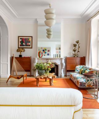neutral living room with mid century furniture and eclectic accessories and pieces