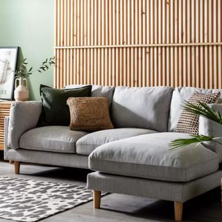 A grey chaise corner sofa in a neutral living room