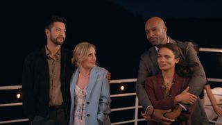 Mike and Brie hugging next to Preacher and Kaia, also hugging while standing on the top deck of a boat at night in Virgin River season 6