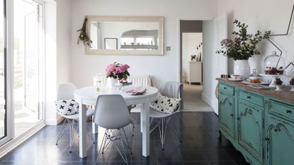 room with white walls and tiled flooring