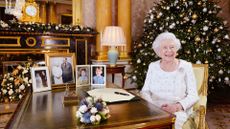 Queen Elizabeth II sits at a desk in the 1844 Room at Buckingham Palace, after recording her Christmas Day broadcast in 2017
