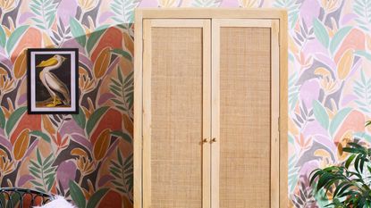 Small bedroom closet ideas are always useful. Here is a wooden closet in front of a purple wall with a bird wall art